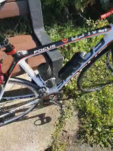 demonstrating bottle mounted to Bike