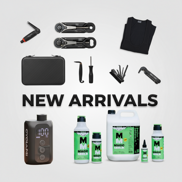 Road cyclist sitting on the ground next to his bicycle