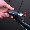 Small CO2 pump from Velo-Tool, easily fits into your back pocket and has your back when you need to inflate your tires during the ride.