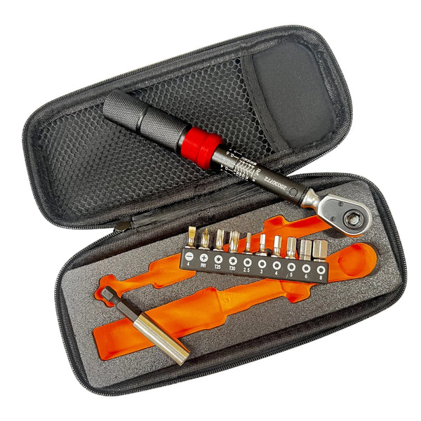 Tool kit with ratchet wrench and bits in an open case on a white background