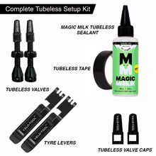 Complete tubeless setup kit with Magic Milk tubeless sealant, tubeless valves, tape, tyre levers, and valve caps on a white background.